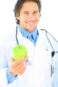 Young doctor with apple