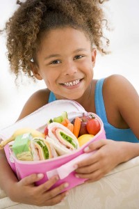 Young girl with packed lunch